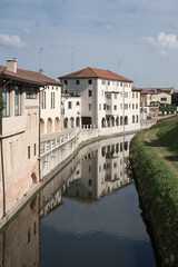 white houses along river Brenta, in Cittadella, Italy
