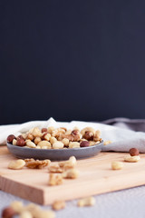 mixed nuts in a bowl on a dark background