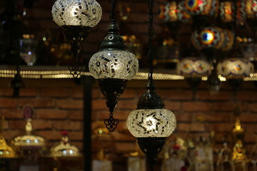 Traditional bright decorative hanging Turkish lamps and colourful lights with vivid colours  in the...