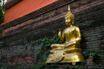 Golden Buddha  is raising his right hand