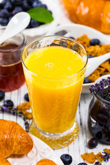 Orange Juice. Continental Breakfast with croissants, cereals and fruits. Selective focus.