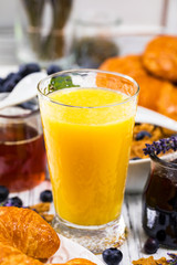 Orange Juice. Continental Breakfast with croissants, cereals and fruits. Selective focus.
