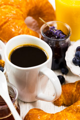 Coffee. Continental Breakfast with croissants, cereals and fruits. Selective focus.