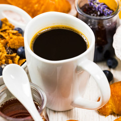 Coffee. Continental Breakfast with croissants, cereals and fruits. Selective focus.