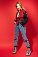 Fashion portrait of trendy young woman in retro style clothes