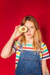 Beautiful girl in retro style clothes with avocado