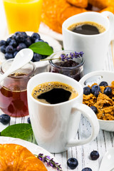 Coffee. Continental Breakfast with croissants, cereals and fruits. Selective focus.