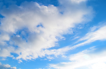 Naklejka na ściany i meble Fabulous blue sky background with white clouds. Nature texture.