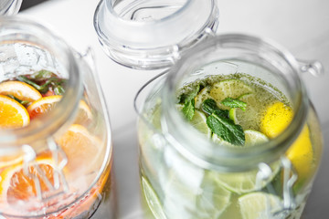 Refreshing lemonade with lime, juice and lemon in glass jars. Concept of drinks, summer, bar, rest, healthy food