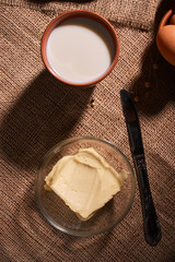Assorted dairy products milk, cheese, butter rustic still life on table