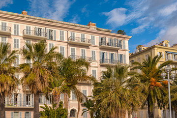 Obraz premium Nice, colorful houses promenade des Anglais, on the French Riviera, with palm trees