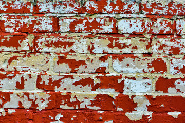 Texture of peeling bricks wall paint.