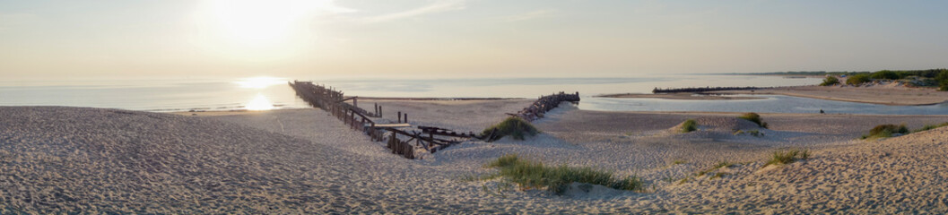 Obraz premium Panorama of sunset on the Sventoji beach