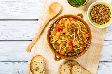 Vegetarian Vegetable Soup on Wooden Background. Selective focus.