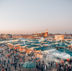 The famous hustle and bustle at the Djemaa el Fna at dusk in Marrakech.