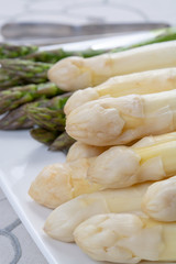 New harvest of white and green asparagus vegetable in spring season, washed asparagus ready to cook, spring menu for restaurants