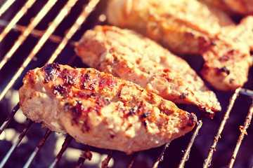 Grilled chicken breast on barbeque
