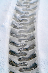 Snowy road with tire tracks during winter in Utah