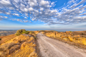 Rocky Road through hilly Mediterranean landscape on the island of Cyprus