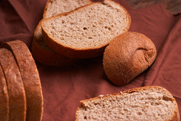 freshly baked bread on dark wooden kitchen table. Selective focus