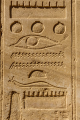 Egyptian ancient hieroglyphs on the stone wall
