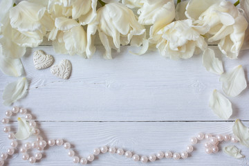 White background with tulips, hearts and pearl beads