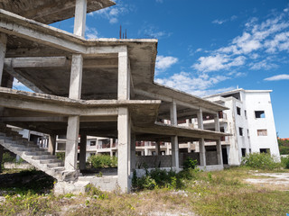 Fototapeta na wymiar Unfinished and abandoned construction of typical caribbean building