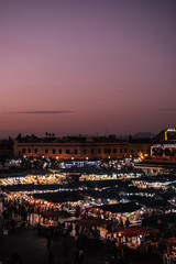 A beautiful panorama view of the famous hustle and bustle at the Djemaa el Fna in Marrakech at dusk.