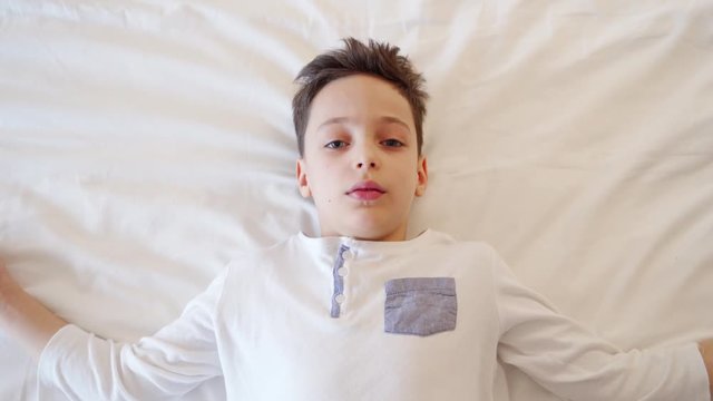 Little Boy Playing, Falls Asleep on Bed Before Bedtime