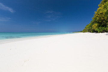 White sandy beach on Maldives island