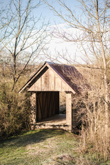 Fototapeta na wymiar Small Wooden Covered Bridge in Wintertime