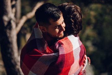 Fototapeta premium love story a guy and a girl in a tent in the mountains in nature