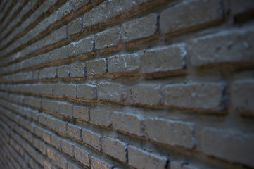 side angle of textured black brick wall interior loft background