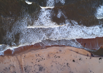 Aerial view. Beautiful seascape with waves crushing at the beach.