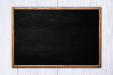 Abstract blackboard or chalkboard with frame on wooden background. - obrazy, fototapety, plakaty