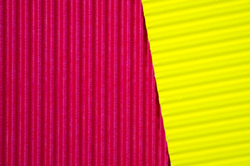 Red and yellow corrugated paper texture, use for background. vivid colour with empty space for add text or object.