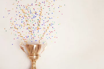 Foto op Canvas Trophy and confetti on light background, top view with space for text. Victory concept © New Africa