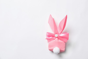 Creative Easter bunny gift bag on white background, top view