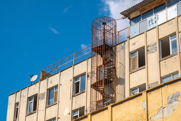fire escape in old building, rusty stairs, abandoned