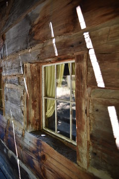 Oakhurst, CA., U.S.A. June 25, 2017. Restored Fresno Flats Historic Village and Park offers visitors a unique glimpse of California’s Sierra Nevada foothills pioneer 1870s dovetail hand-hewn log cabin