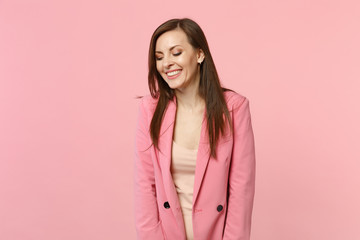 Fototapeta premium Portrait of attractive pretty laughing young woman wearing jacket keeping eyes closed isolated on pastel pink wall background in studio. People sincere emotions, lifestyle concept. Mock up copy space.