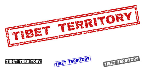 Grunge TIBET TERRITORY rectangle stamp seals isolated on a white background. Rectangular seals with distress texture in red, blue, black and gray colors.