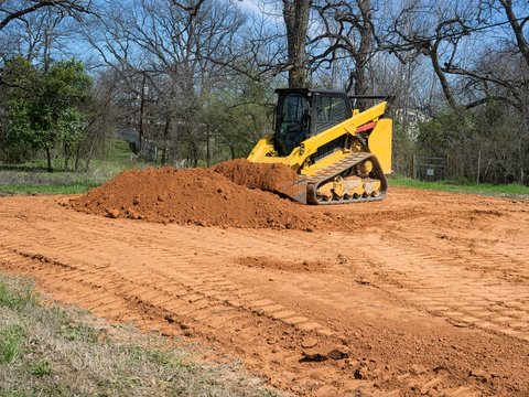 Skidsteer Getting a Bucket of Dirt