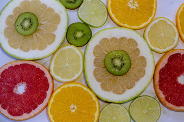 Citrus fruit slices on table