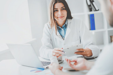 Doctor consulting patient. Patient sitting at doctor office. Diagnostic, prevention of diseases,...