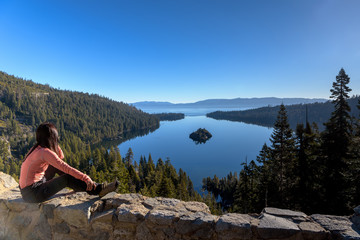 A woman traveller enjoying view of Emerald Bay in the morning, California, USA
