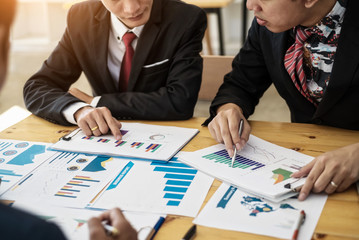 Group of business people discussing project plan together with analyzing data financial report in meeting room. Finance accounting concept.