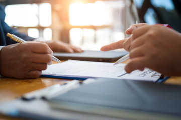 Business people discussion and negotiating investment housing estate with sign a contract term loan facility in office. contract and agreement concept.