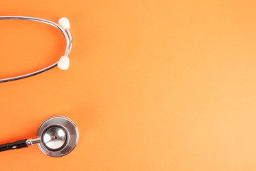 Fototapeta na wymiar Medical Concept with stethoscope ,syringe isolated on orange background. Copy Space