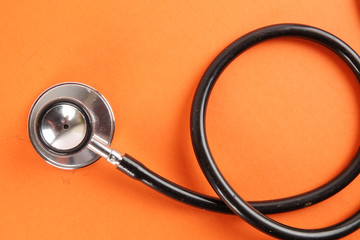 Fototapeta na wymiar Medical Concept with stethoscope ,syringe isolated on orange background. Copy Space